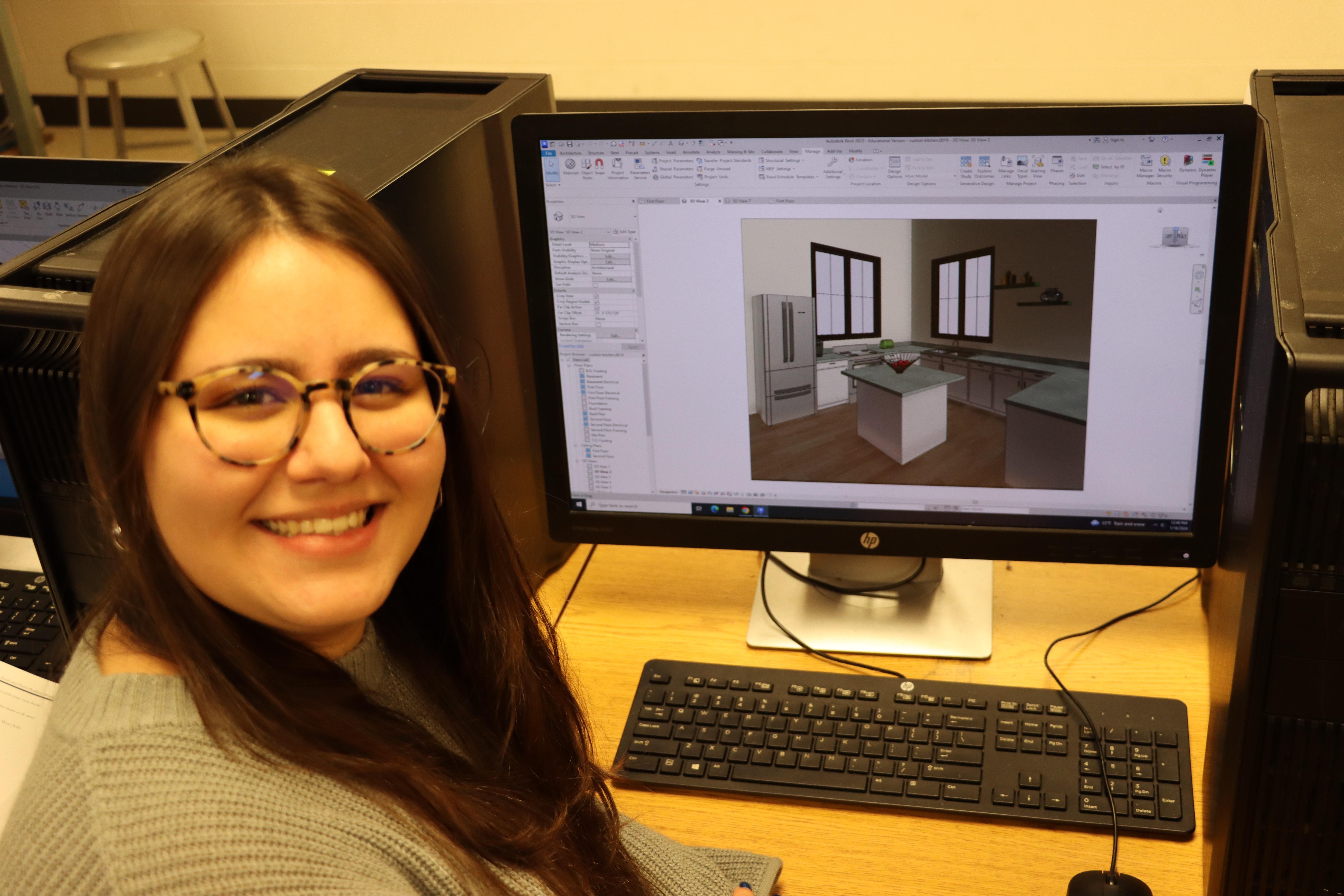 Leticia Lopes at a computer with a CAD program